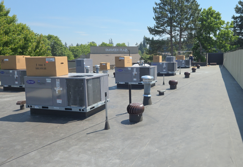 GAF Everguard TPO commercial flat roof in Dark Bronze with rooftop HVAC units