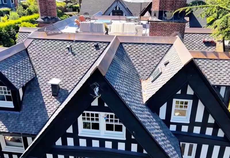 Close-up of Owens Corning Woodmoor shingles in Granite with custom copper ridge caps