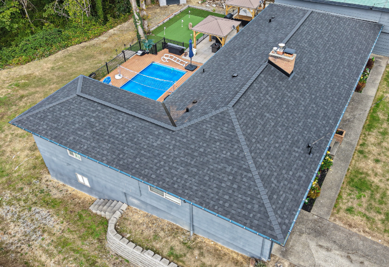 Aerial view showing the completed roof and intersecting rooflines