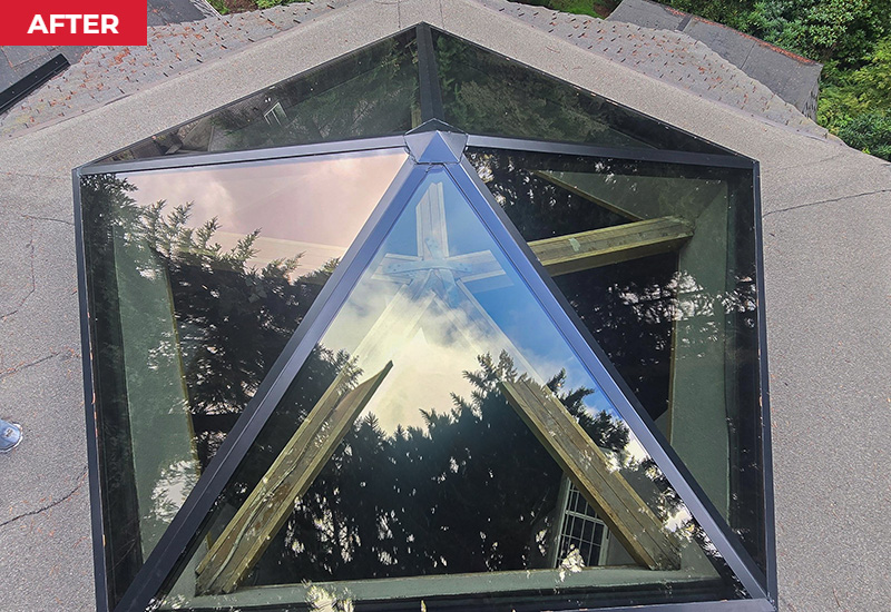 Aerial view of the completed custom pyramid skylight with black metal framing