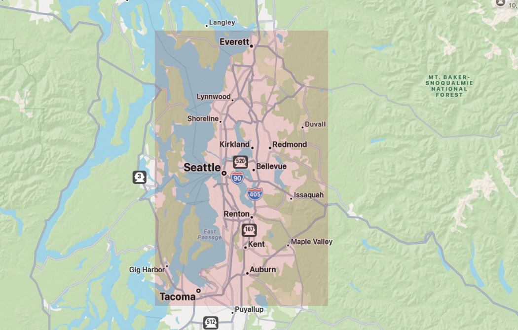 A map of the Seattle metropolitan area highlights cities such as Seattle, Tacoma, Everett, Bellevue, and surrounding areas in pink—clearly outlining the roof boss service areas—along with highways and major roads also displayed.
